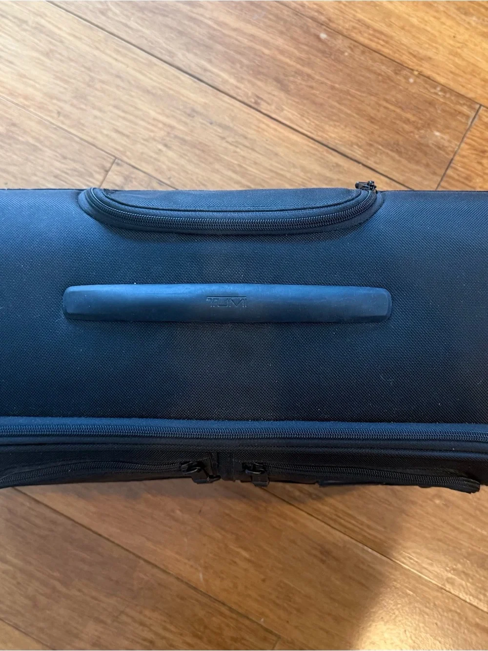 Tumi Black Garment Spinnerwith Front Organization Pockets